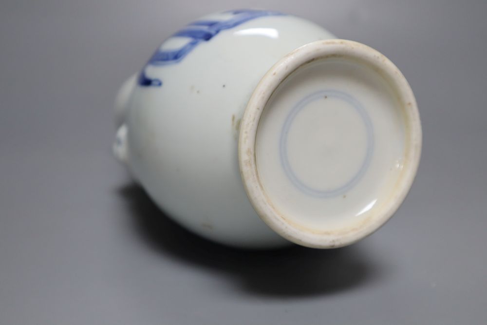 A Chinese porcelain vase, with moulded mask ring handles, 23cm